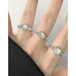 S925 silver rings with green agate stones and unique wrinkled texture on white background