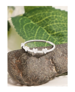 Detailed view of S925 silver ring featuring three small hearts on a natural stone base