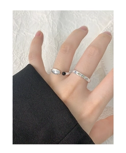 Close-up of S925 silver U-shaped black agate ring and colorful gemstone band on model