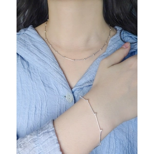 Minimalist S925 sterling silver bamboo joint chain necklace and bracelet set on model