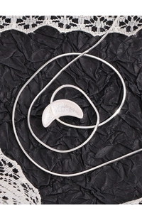 Detailed view of the S925 sterling silver moon pendant showing the material hallmark
