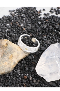 Detail of S925 sterling silver ring featuring engraved butterfly and yellow zircon stone