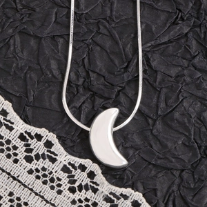 Polished silver crescent moon pendant with sleek snake chain for women minimalist jewelry