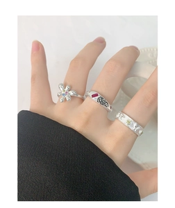 Detailed shot of S925 silver ring set with colorful zircon flowers and rose relief