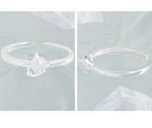 Macro detail of S925 sterling silver ring showing hallmark and star design