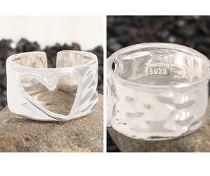 Detail shot of S925 sterling silver ring featuring hollow heart and hammer texture