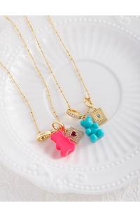 Close-up of S925 silver bear necklaces with heart-shaped zircon and colorful resin charms