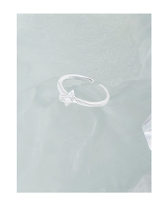 Close-up of S925 sterling silver stamp and minimalist star design on adjustable ring