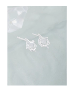 Macro shot of S925 sterling silver stamp on minimalist star-shaped stud earrings