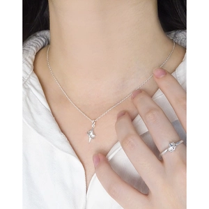 Minimalist S925 sterling silver four-pointed star necklace and ring set on model