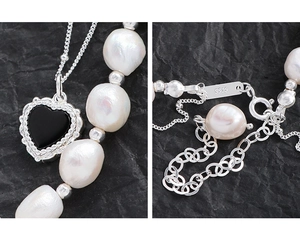 Close-up of S925 sterling silver clasp and baroque pearls on heart pendant necklace