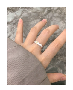 Detailed macro view of S925 silver ring featuring a gold star and heart relief design
