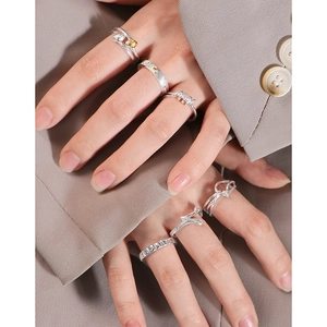Minimalist S925 silver cross knotted geometric ring set styled with office casual wear