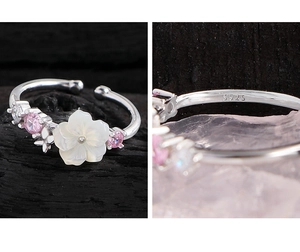 Macro detail of S925 sterling silver stamp on an adjustable flower shell ring