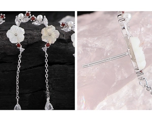 Macro shot of S925 silver stamp and shell flower tassel earring with zircons