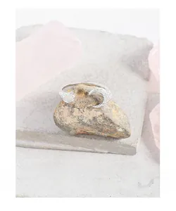 Close-up of S925 silver moon ring with translucent agate on raw crystal stones