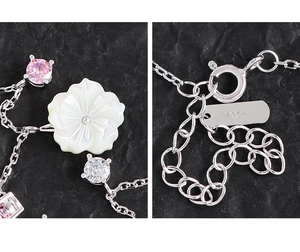 Detail of S925 silver necklace with shell flower, zircons, lobster clasp and extension chain