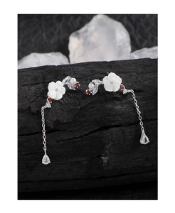 Detailed macro view of S925 silver shell flower earrings with pearl and teardrop crystals