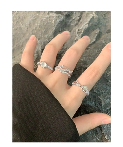 Detailed close-up of S925 silver rings with irregular texture and green agate stones