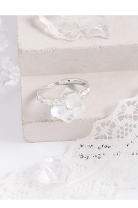 Macro shot of S925 silver ring featuring wrinkled texture and square white agate stone