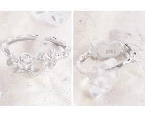 Macro detail of S925 sterling silver ring showing molten lava texture and heart shape