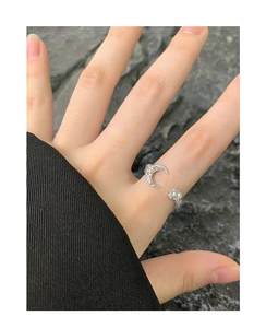 Detail of S925 silver moon ring with wrinkled texture and green moonstone on hand