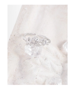 Detailed macro view of silver S925 ring with irregular lava texture and pearl inlay