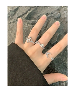 Detailed view of silver S925 rings set featuring celestial star and crescent moon motifs