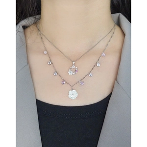 S925 silver layered necklace with shell flower and zircon pendant worn by model