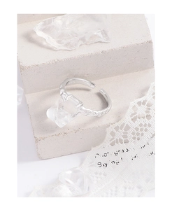 Close-up of S925 sterling silver ring featuring a white square stone and lava texture