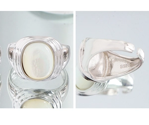 Detail shot of S925 sterling silver stamp and white oval shell inlay on ring band