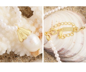 Detailed view of baroque pearl pendant with gold S925 sterling silver hardware