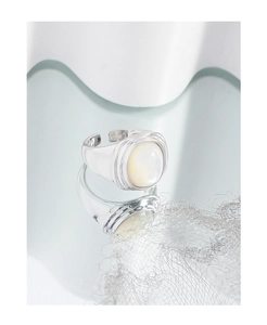 Macro detail of S925 silver ring with oval white mother-of-pearl and adjustable band