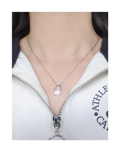 Close-up of S925 silver necklace with square transparent crystal pendant on a model
