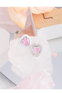 Macro detail of S925 sterling silver heart earrings with pink zircon and hallmark