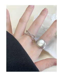 Detail of S925 silver signet ring with white mother of pearl inlay and beaded band