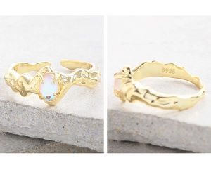 Detailed macro view of S925 sterling silver hallmark and lava texture on 18k gold ring