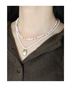 Detail of S925 silver double layer pearl necklace with lily of the valley floral charm