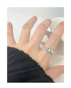 Detailed close-up of S925 sterling silver ring with irregular moonstone on female finger
