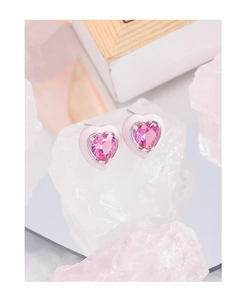 Detail of S925 silver stud earrings with pink enamel heart and central zircon inlay
