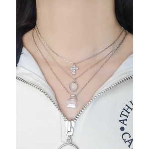 Three-layer S925 silver necklace featuring crystal heart and cross pendants on model