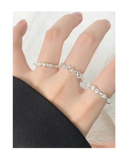 Detailed close-up of S925 silver rings with unique wrinkled textures and pearl accents