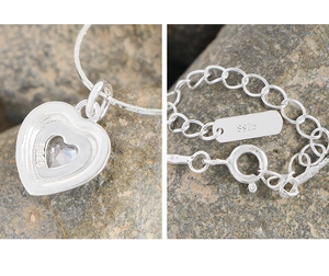 Detail view of S925 sterling silver heart necklace with zircon and material hallmarks