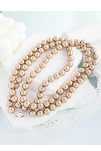 Detail showing S925 silver clasp on champagne pearl necklace with macro focus
