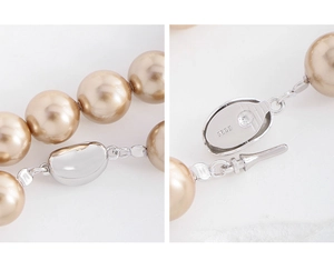 Close-up of S925 sterling silver clasp and champagne pearls on a luxury necklace