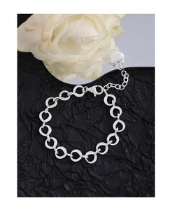Close-up of S925 sterling silver heart pendant bracelet with lobster clasp and hallmark