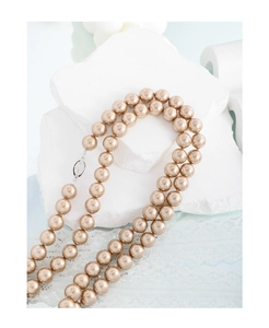 Macro shot of S925 silver clasp and champagne gold pearl double-row necklace