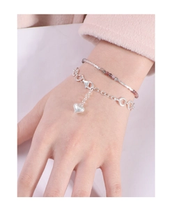 Close-up of S925 silver link bracelet with heart pendant and multi-color tourmaline beads