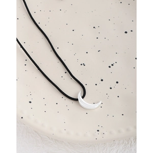 Polished silver crescent moon pendant necklace with minimalist black adjustable cord