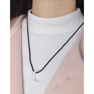 Minimalist S925 sterling silver moon pendant necklace with black cord shown on neck